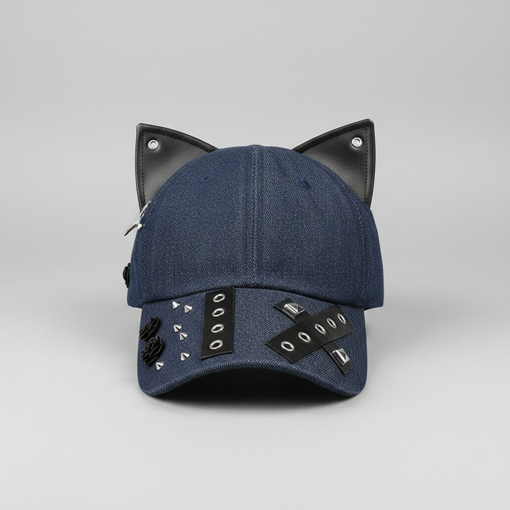 Blue denim cap with black accents on a wooden surface