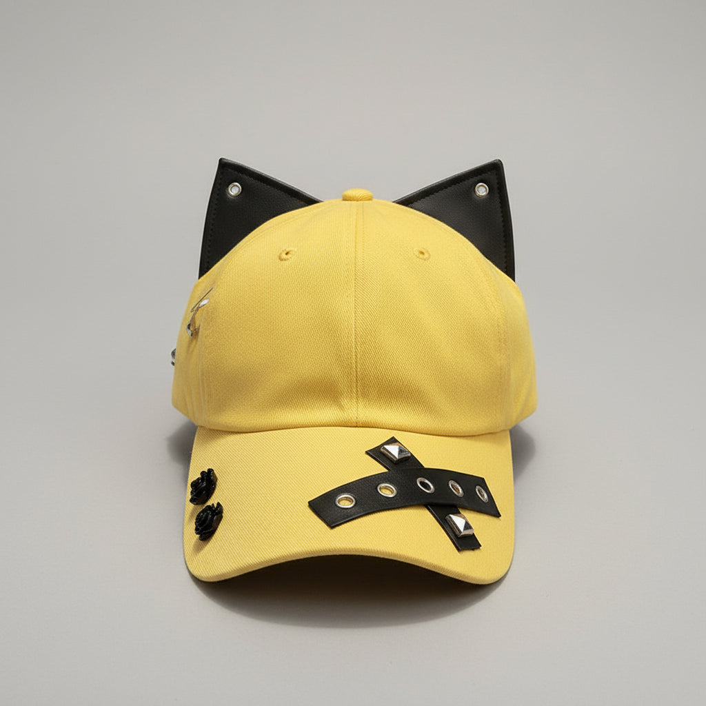 Yellow cap with black decorative elements on a wooden surface