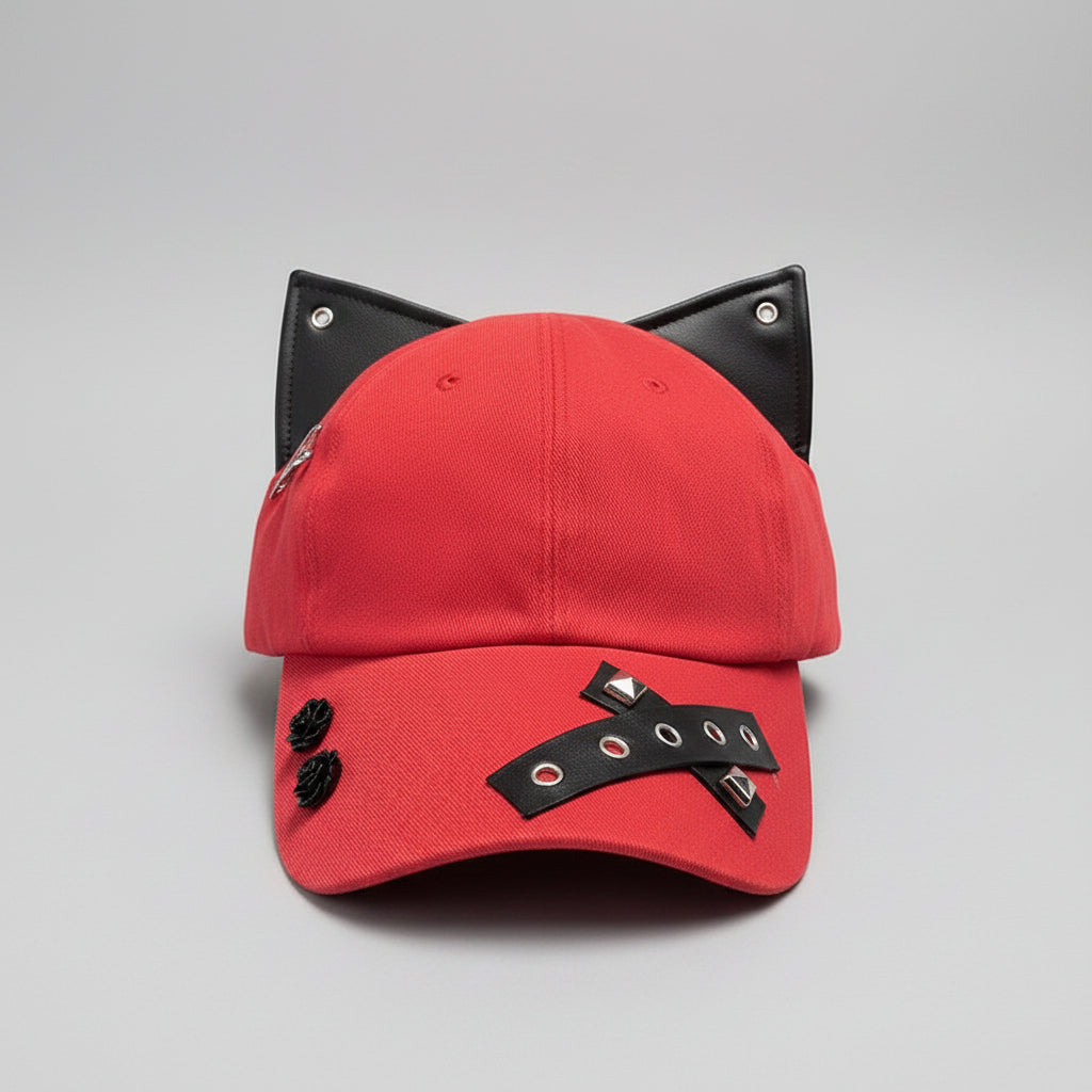 Red cap with black accents on a wooden surface