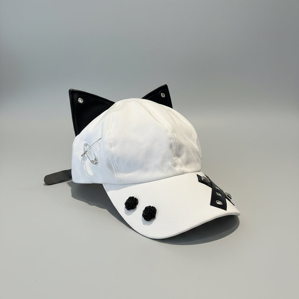 White cap with black accents on a wooden surface